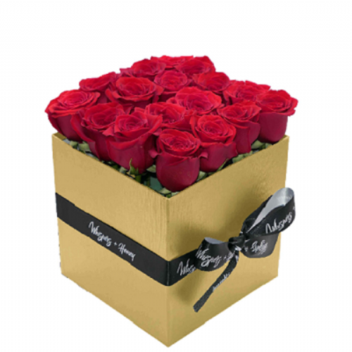Red roses in a gold box